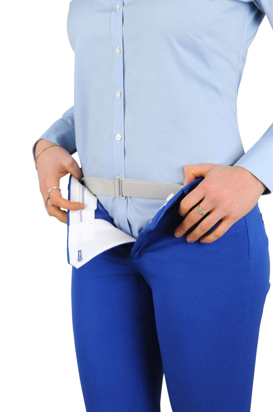 Woman wearing Tuck-N-Sta under her pants but over her shirt keeping her shirt neatly tucked all day